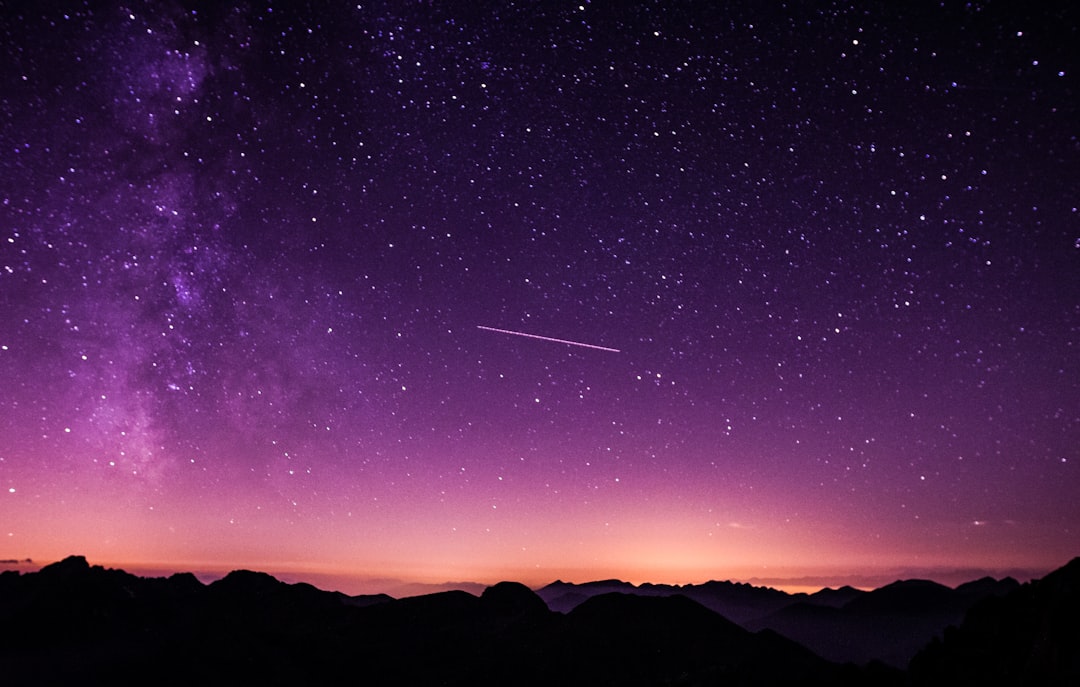 Sublime purple night sky by Endless Relaxation silhouette photo of mountain during night time